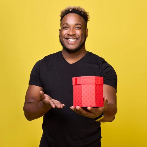 smiling-man-holds-his-hand-red-box-with-surprise-wants-give-holiday (1)